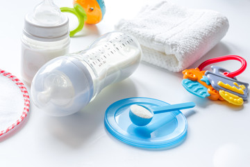 preparation of mixture baby feeding on white background