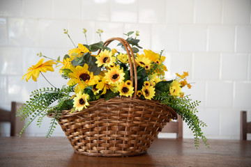 Flower arrangement composed of a wicker basket and sunflowers
