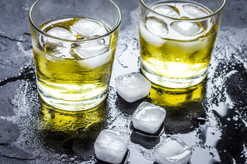 glass of whiskey on dark background