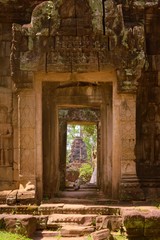 Stone doorway leading to the main courtyard of Banteay Kdei temple, in Angkor Wat complex near Siem Reap, Cambodia.