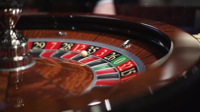 Roulette in the casino spins and white ball