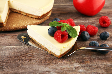 Homemade cheesecake with fresh raspberries and mint for valentines day - healthy organic summer...