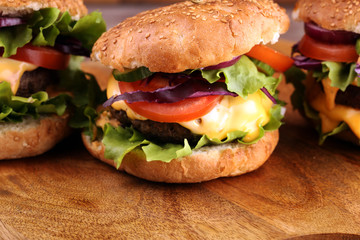 Tasty fresh meat burgers with salad and cheese. Homemade angus burger.