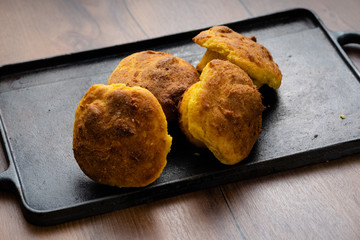 HANDCRAFTED CORN BREAD, ECUADORIAN KITCHEN RECIPE, SERVED ON WOODEN TABLET