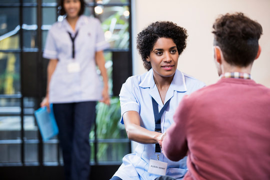 Portrait of Woman in healthcare industry having consultation with patient, East London, Great Britian