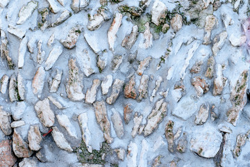 Textured stone wall. Background of wall of rude grey stones.