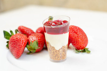 cheesecake in plastic cup with strawberry
