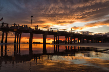 Fototapeta premium Vibrant sunset on Coney Island beach and pier