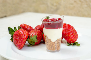 cheesecake in plastic cup with strawberry
