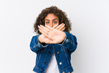 Young african american woman doing a denial gesture