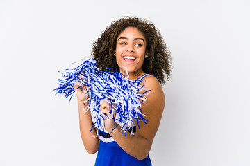 Young cheerleader woman isolated on white background
