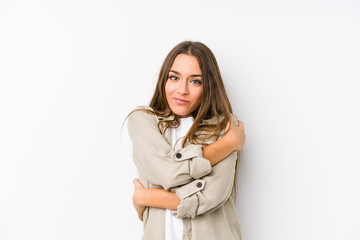 Young caucasian woman  isolated hugs, smiling carefree and happy.