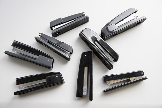 Overhead shot of eight staplers., Jacksonville, Florida, USA