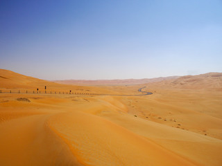 Fototapeta na wymiar Desert road from Liwa to Moreeb dune