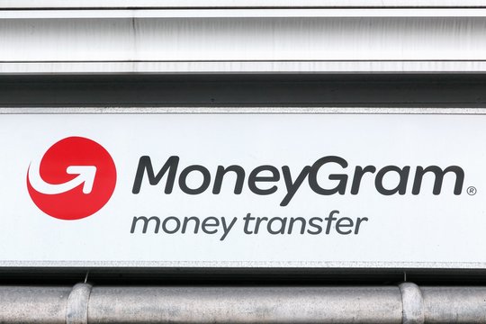 Copenhagen, Denmark - April 2, 2019: MoneyGram logo on a wall. MoneyGram International Inc. is a money transfer company based in the United States with headquarters in Dallas, Texas