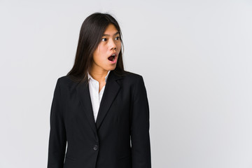 Young asian business woman being shocked because of something she has seen.