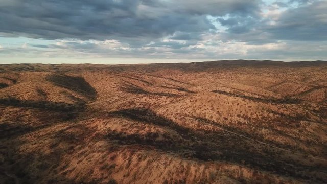 4K aerial drone summer day video African savanna and dry riverbeds surrounded by bush covered hills in Daan Viljoen National Game Park in Khomas Hochland area near Windhoek, Namibia's capital, Africa