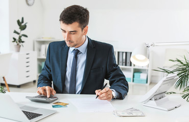 Male bank manager working in office