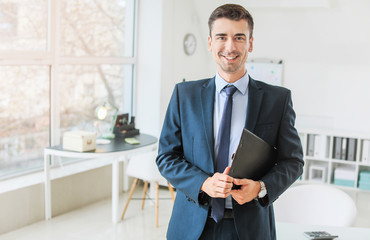 Portrait of male bank manager in office