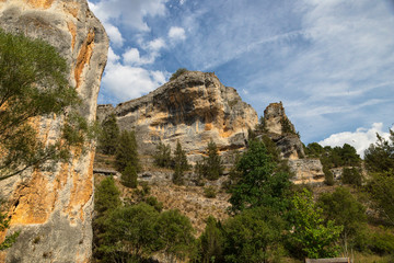 Fototapeta na wymiar Cliffs and caves where vultures nest in Soria Spain