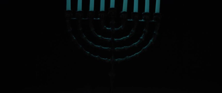 Hanukkah menorah candles in a dark room, slow motion, BMPCC 4K