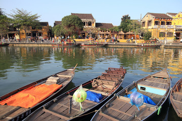 Fototapeta na wymiar Thu bon River with boats scenery in Hoi An, Vietnam, February 2, 2020