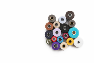 Sewing thread spools isolated on whte with copy space