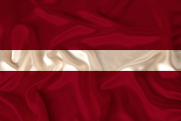 photo of the national flag of Latvia on a luxurious texture of satin, silk with waves, folds and highlights, close-up, copy space, concept of travel, economy and state policy, illustration
