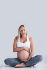 pregnant woman holding the belly, yoga exercise