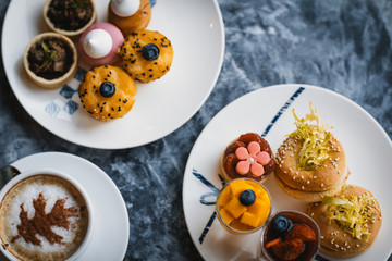 Afternoon tea pastry with coffee and chocolate cup