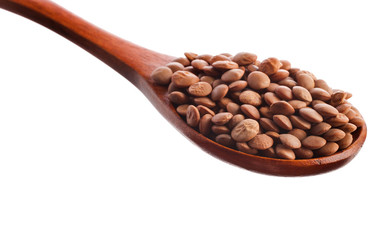 Brown lentils in the wooden spoon isolated on a white background. Top view.
