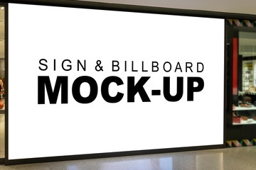 Mock up Large blank advertising billboard on wall of shop
