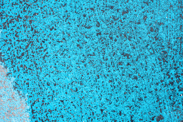 Texture. Aqua blue paint in asfalt.