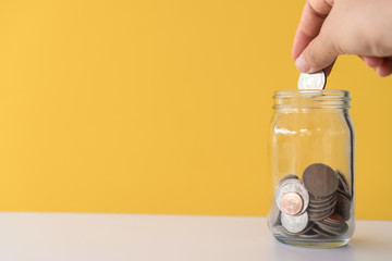 The jar full of coin and bank notes meaning of saving money investment.
