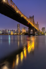 Fototapeta na wymiar View on Queensboro bridge and Midtown During sunrise from East river with long exposure