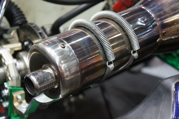 Closeup go kart exhaust  in service station