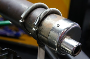 Closeup go kart exhaust  in service station