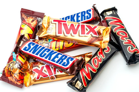 Croydon,UK - January 25, 2020: Illustrative editorial of mixed chocolate candy bars still in wrapper (Snickers, Mars, Lion and Twix) isolated on white background