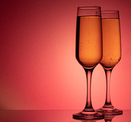 champagne glasses on a red background