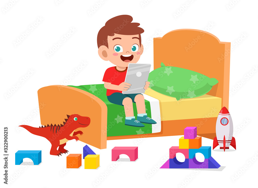 Wall mural happy cute little kid boy play with tablet in bed room