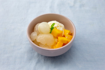 Garnished lychee and mango with vanilla ice cream