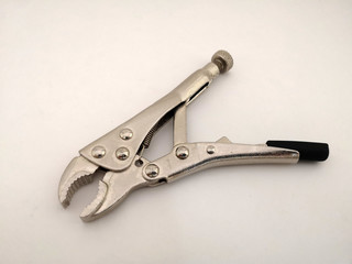 Mini locking pliers isolated on a white background.