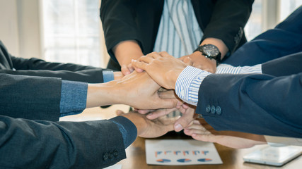 Many business people join hands and agree to do business. The concept of the agreement