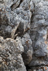 Closeup  of rocks as a part of mountain. Vertical view.