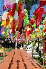 Fototapeta premium Scenery of colorful handmade paper lantern hanging in front of the temple. Vertical view. 