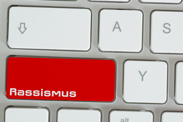 Ein Computer und Taste für Rassismus im Netz