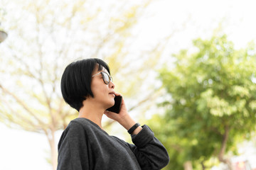 Asian woman talking on cellphone