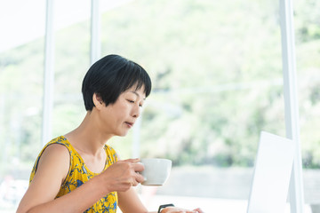 Asian woman working and using laptop