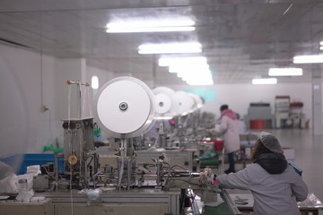 Mask factory works overtime 24 hours to produce medical masks for hospitals