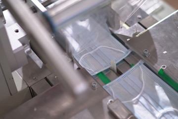 Automated equipment to accelerate the production of disposable medical masks